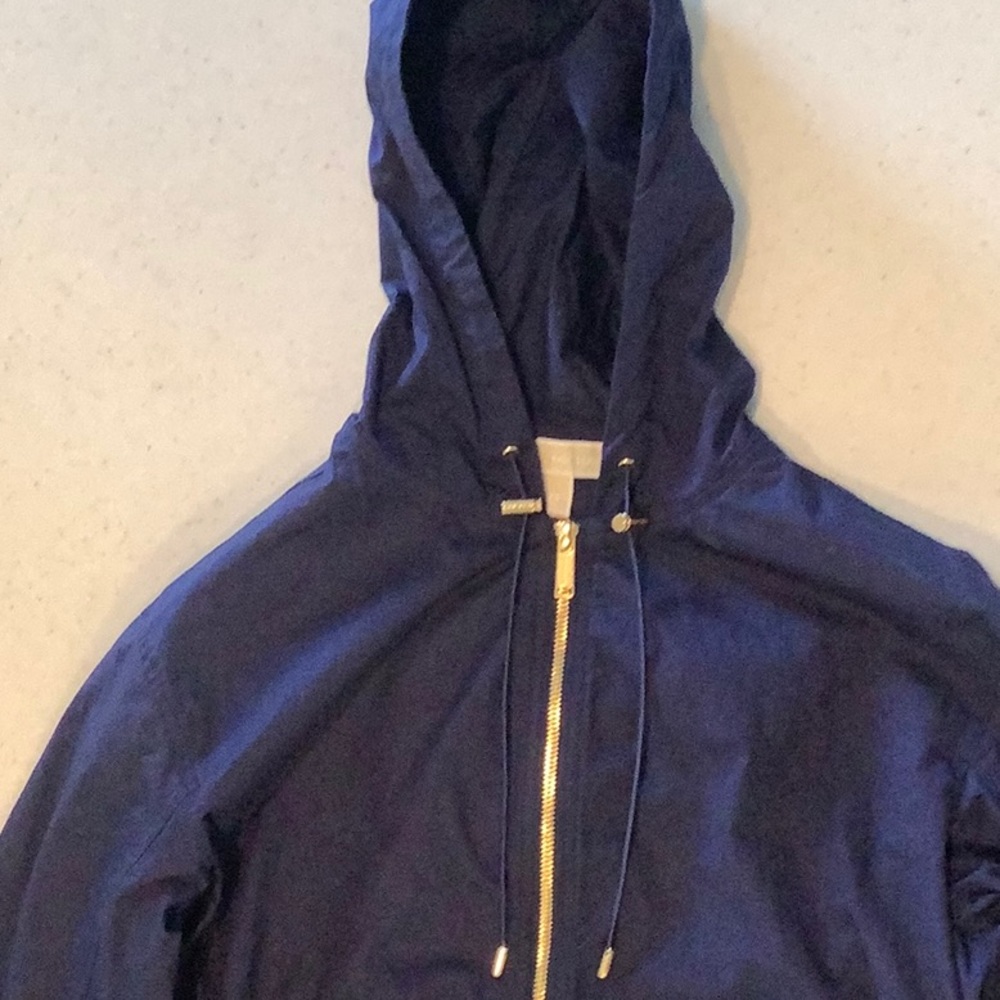A deep dark blue rain coat from Michael Kors. Size: XS